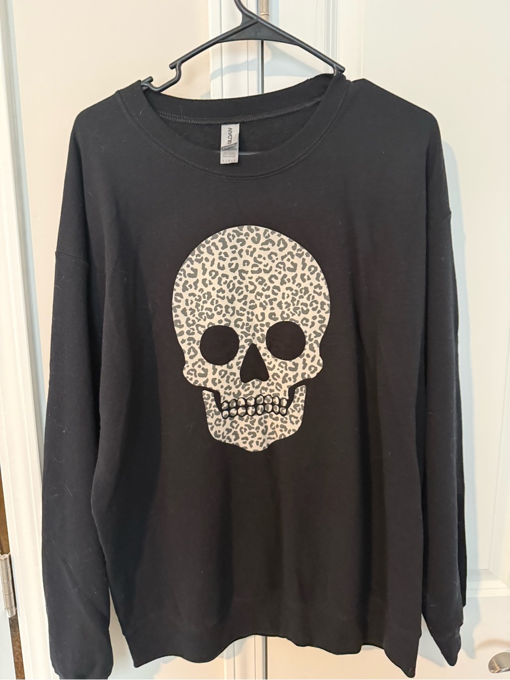 Pink Lily Black Sweatshirt with Leopard Skull Graphic